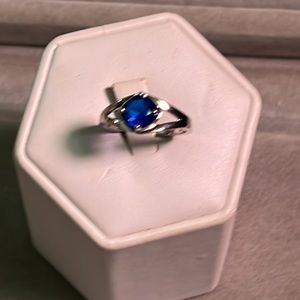 Silver tone ring with blue stone